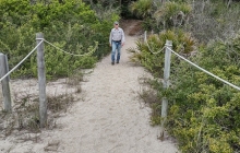 Dennis on the path to the beach
